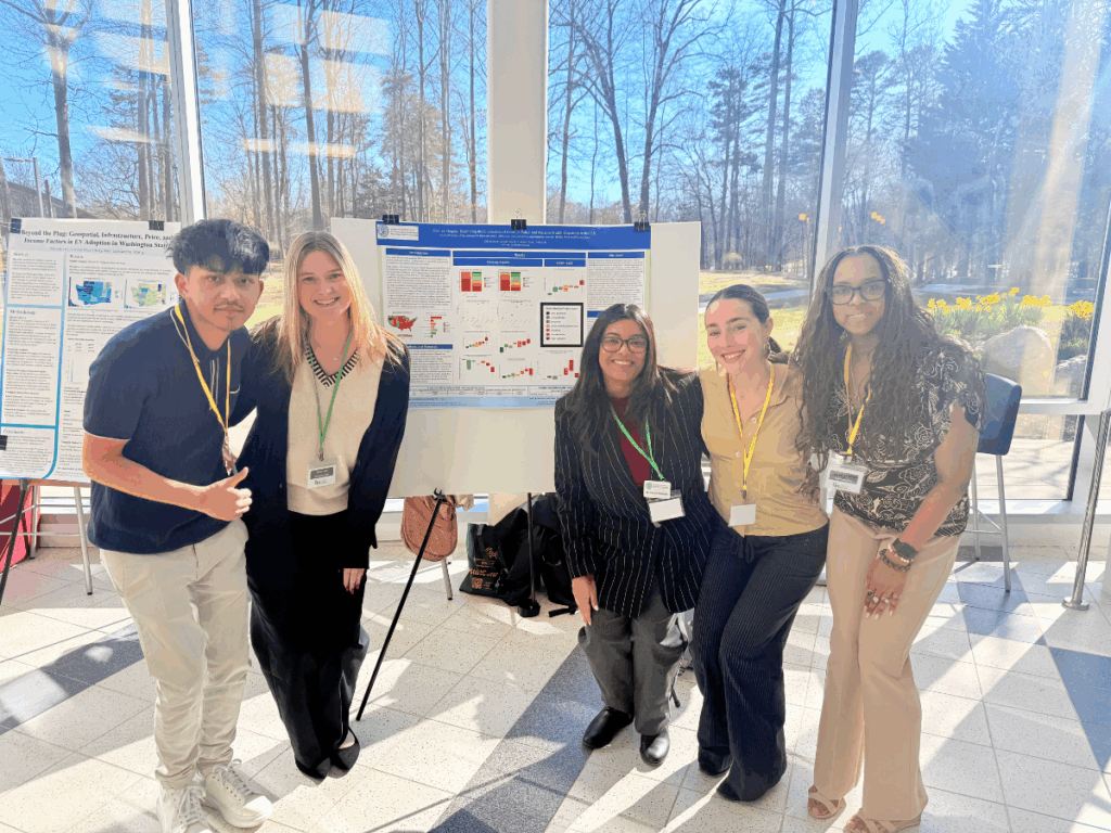 DSAN students pose with their award-winning poster at the 2025 StatConnect Conference.