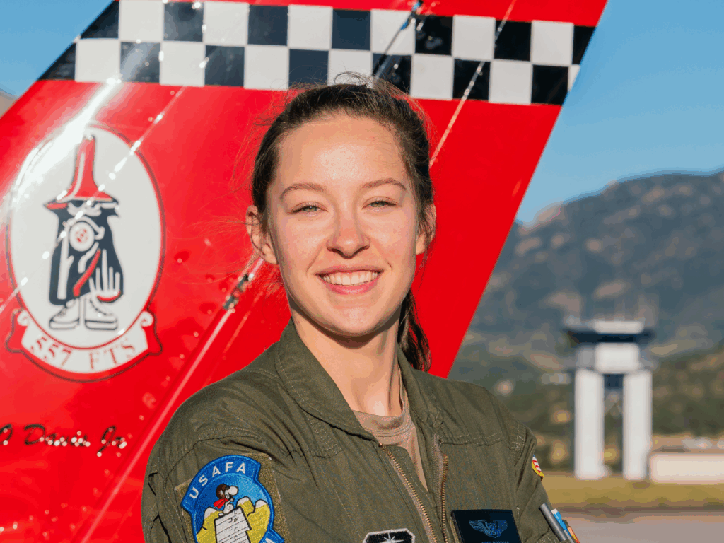 Erin Brzusek, in Air Force pilot jumpsuit