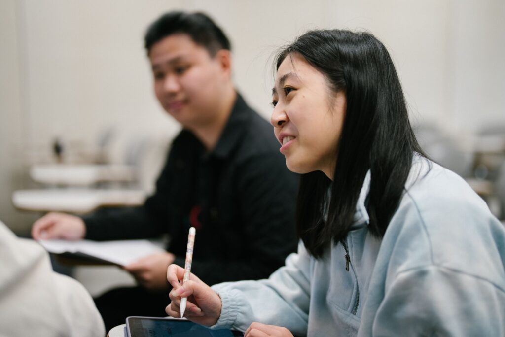 Two students listen intently in class.