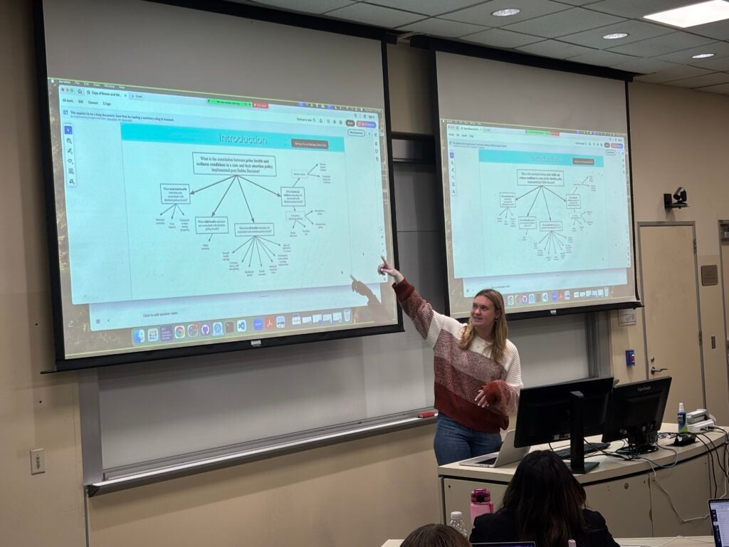 Kristin presenting to the 5100 class.