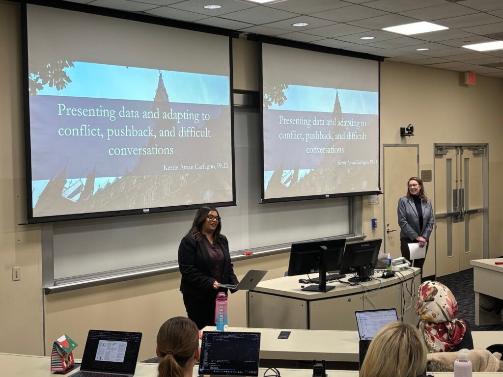 Dr. Purna introduces Dr. Carfagno to DSAN students.