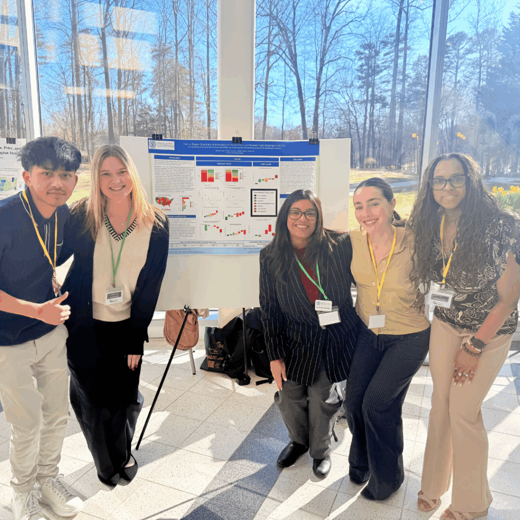 Students pose with their award-winning poster at the StatConnect 2025 conference.