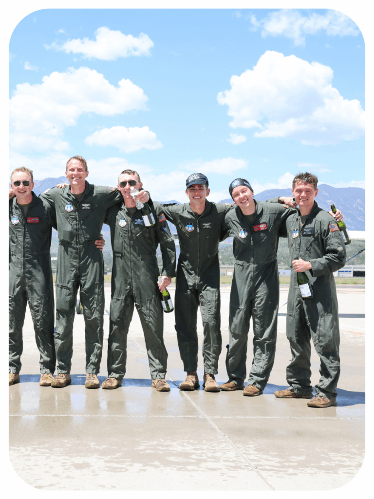 Erin poses on the tarmac with fellow Air Force pilots.