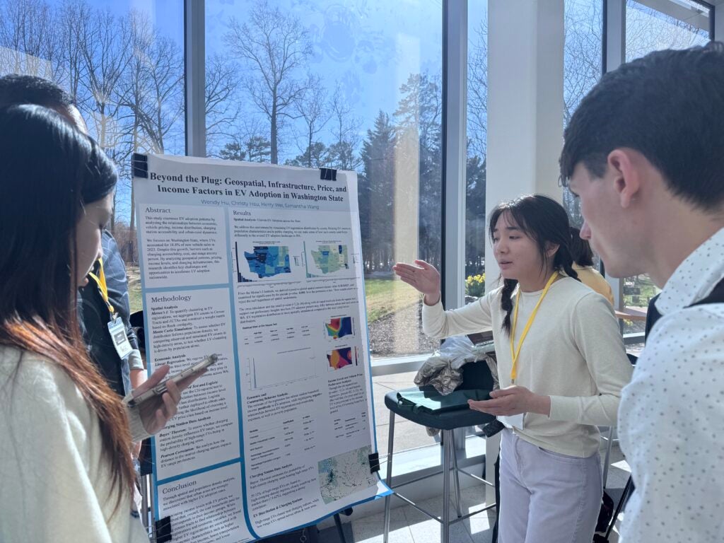 Student presents her poster