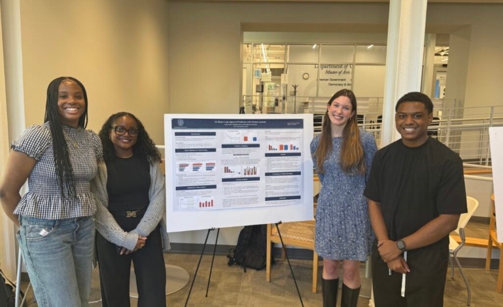 Nkem and her group in from of their Statistical Learning photo.
