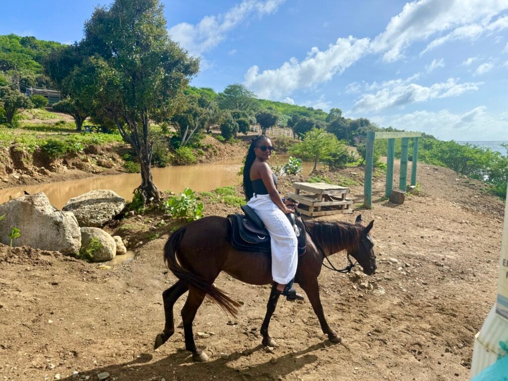 Nkem riding a horse.
