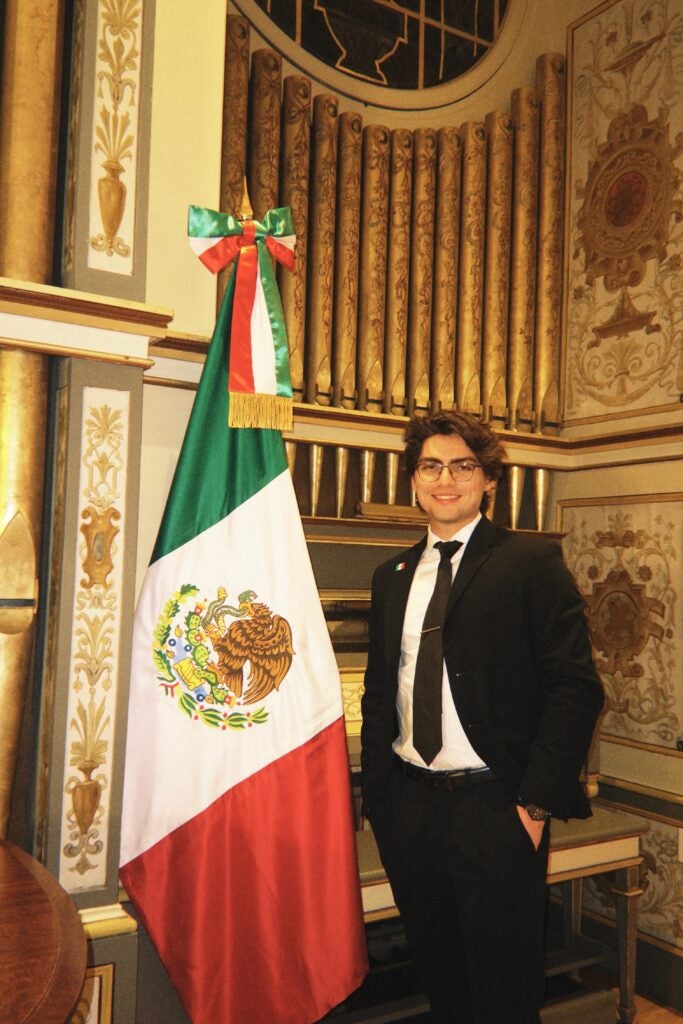 Sam posing with the Mexican flag at the MSFS Winter Ball