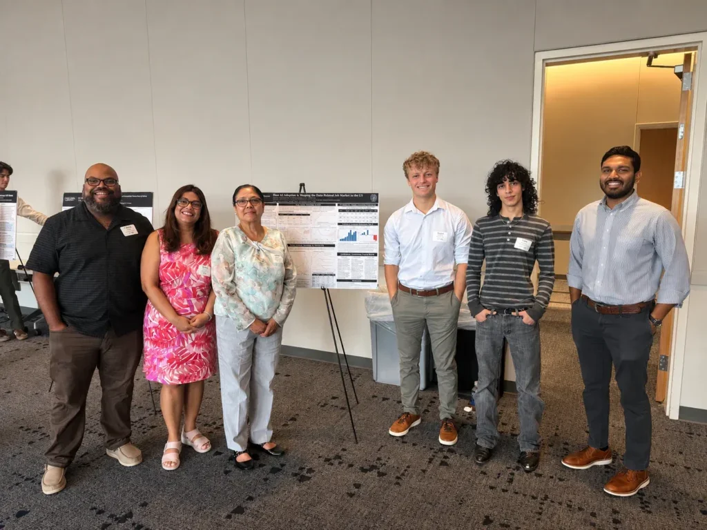 DSAN advised student researchers pose with their poster